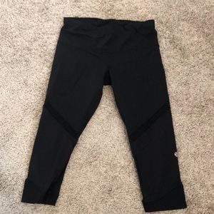 Black cropped lululemon leggings with mesh detail